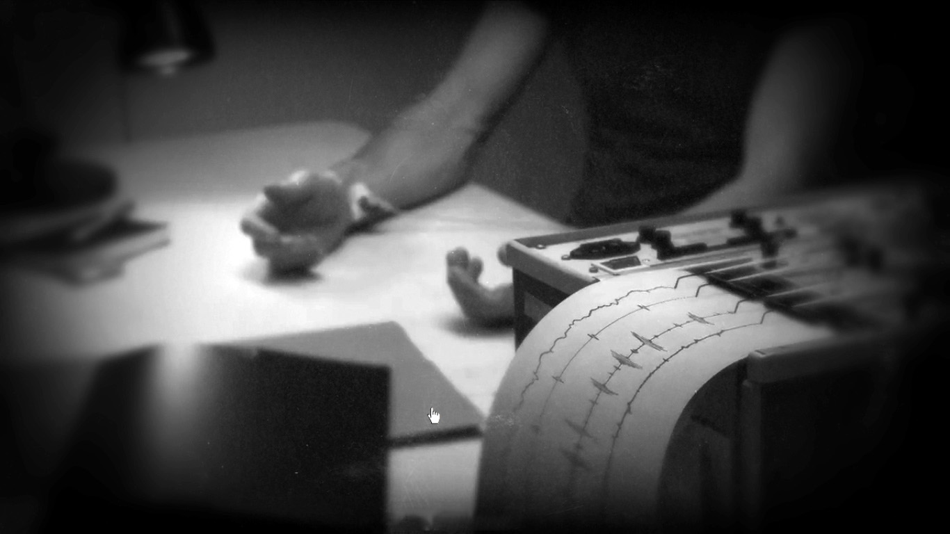 A black-and-white film still from The Black Diamond: a figure sits at a brightly lit desk while a vintage polygraph machine in the foreground records wavy lines on a rolling paper tape, the mood tense and interrogative.