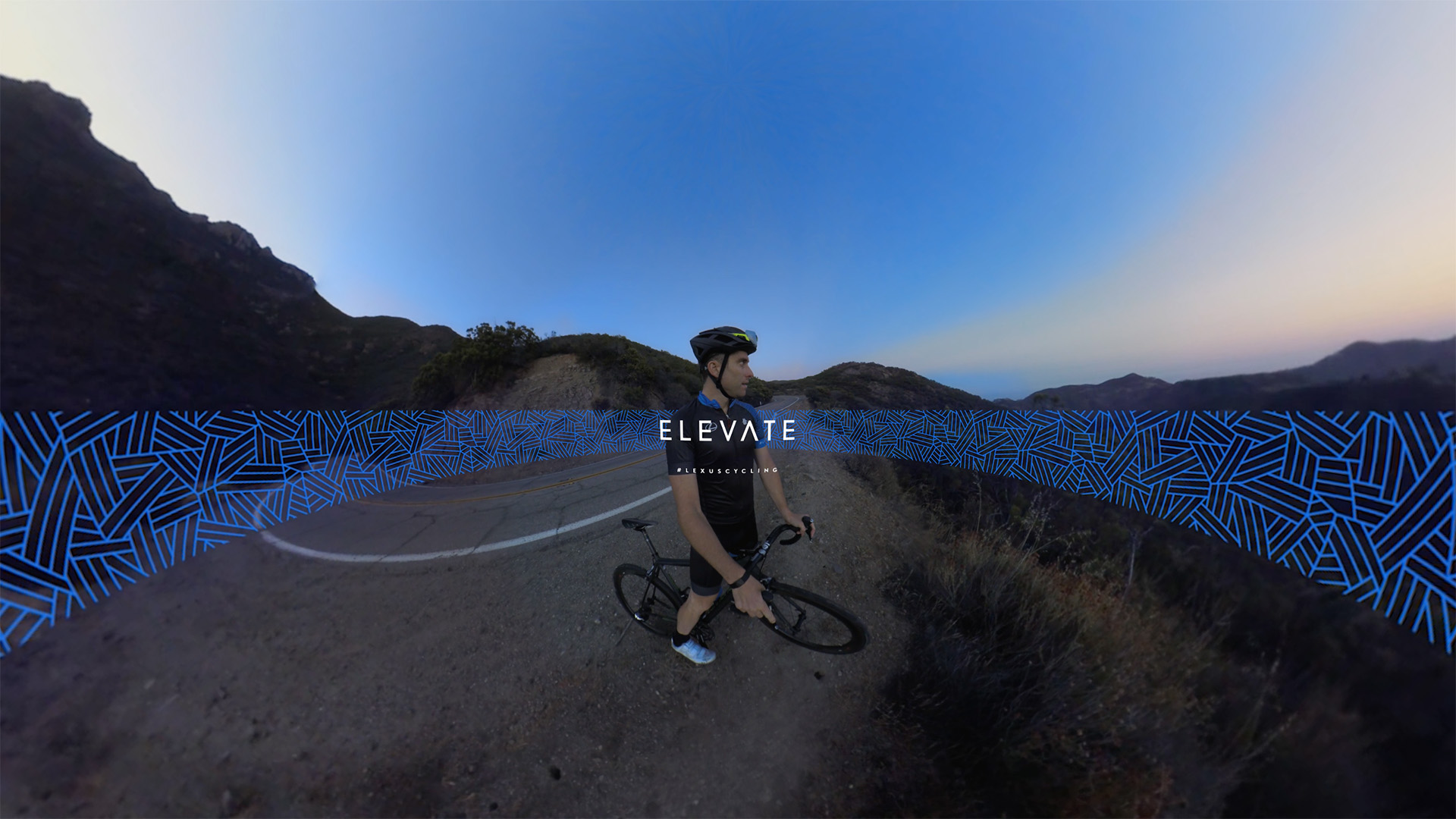 Elevate title card: Christian Vande Velde stands with his road bike on a winding Malibu mountain road at dusk, the ELEVATE title and #LexusCycling hashtag overlaid as a graphic band across the frame.