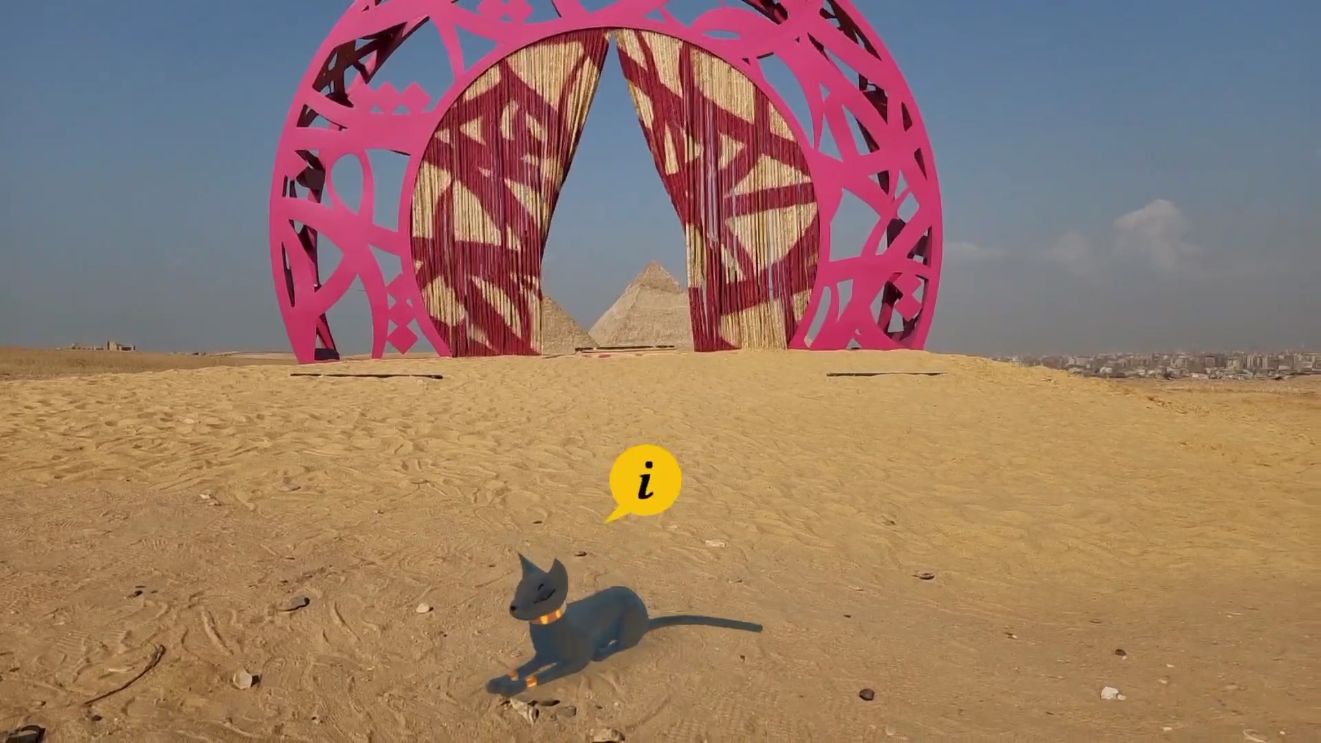 A photo from the art exhibition around the pyramids in Egypt, showing our virtual guide Bastet