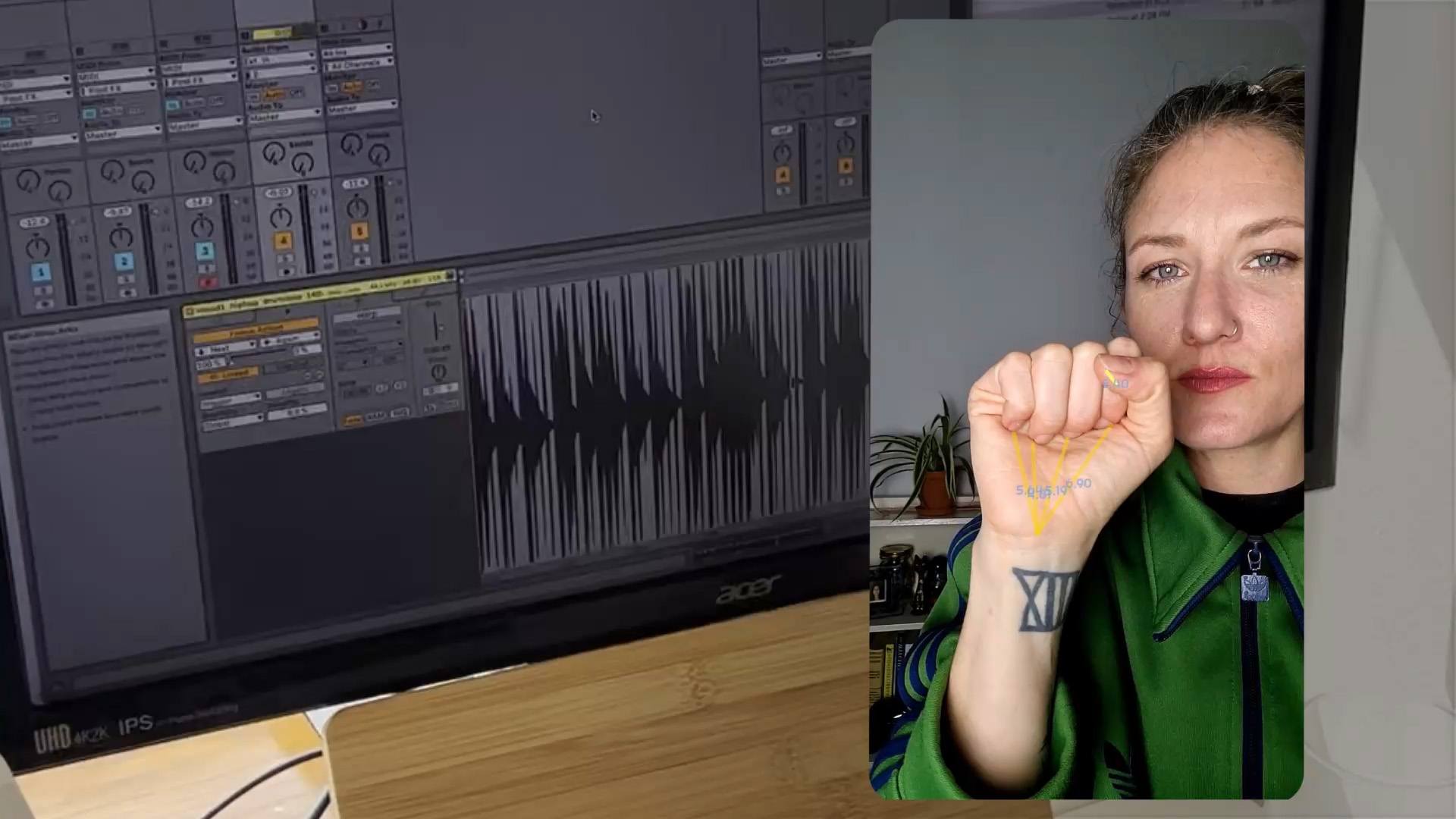 An animated gif of Grace trying one of our finger instruments, where we use individual finger tracking to create music