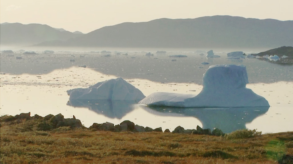 A screenshot of an ice berg floating through a river