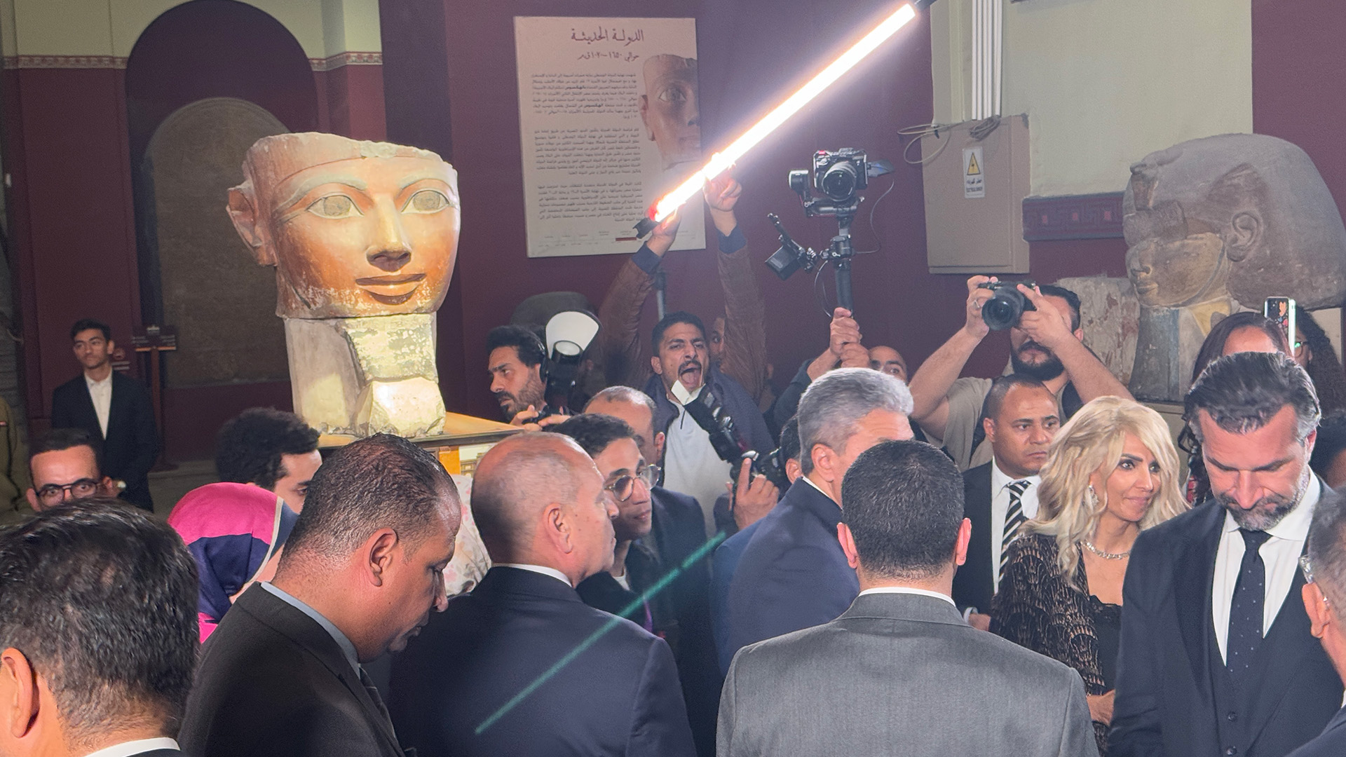 The Hatshepsut statue at the launch event, surrounded by government officials and press 