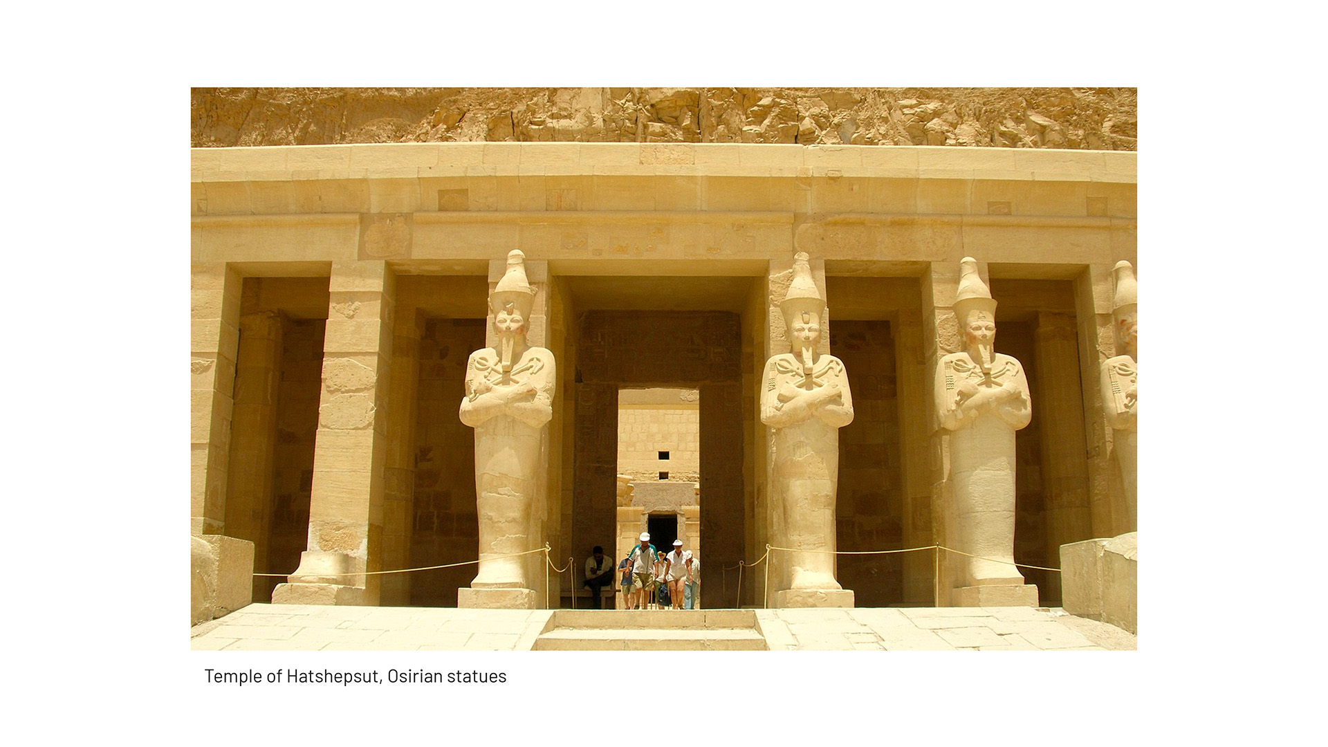 REVIVAL: A reference photo captioned Temple of Hatshepsut, Osirian statues, showing colossal Osiride pillar statues at the temple's entrance with visitors nearby.