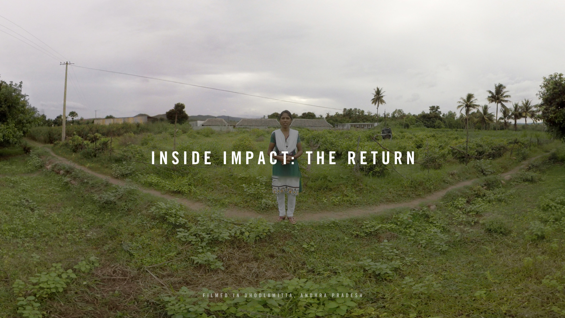 The Return: title card reading Inside Impact The Return, showing a girl standing at a fork in dirt paths through a green rural field in Andhra Pradesh, with palm trees, small houses and an overcast sky in the background.